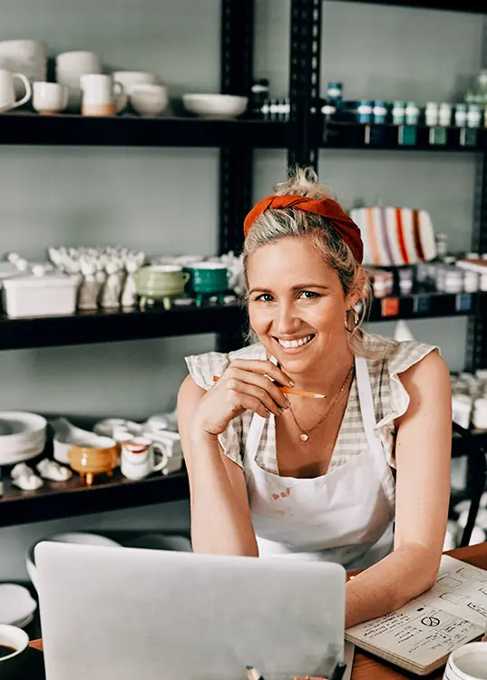 E-commerce business owner happy with her paid ads